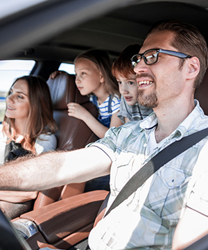 White family inside car, on trip